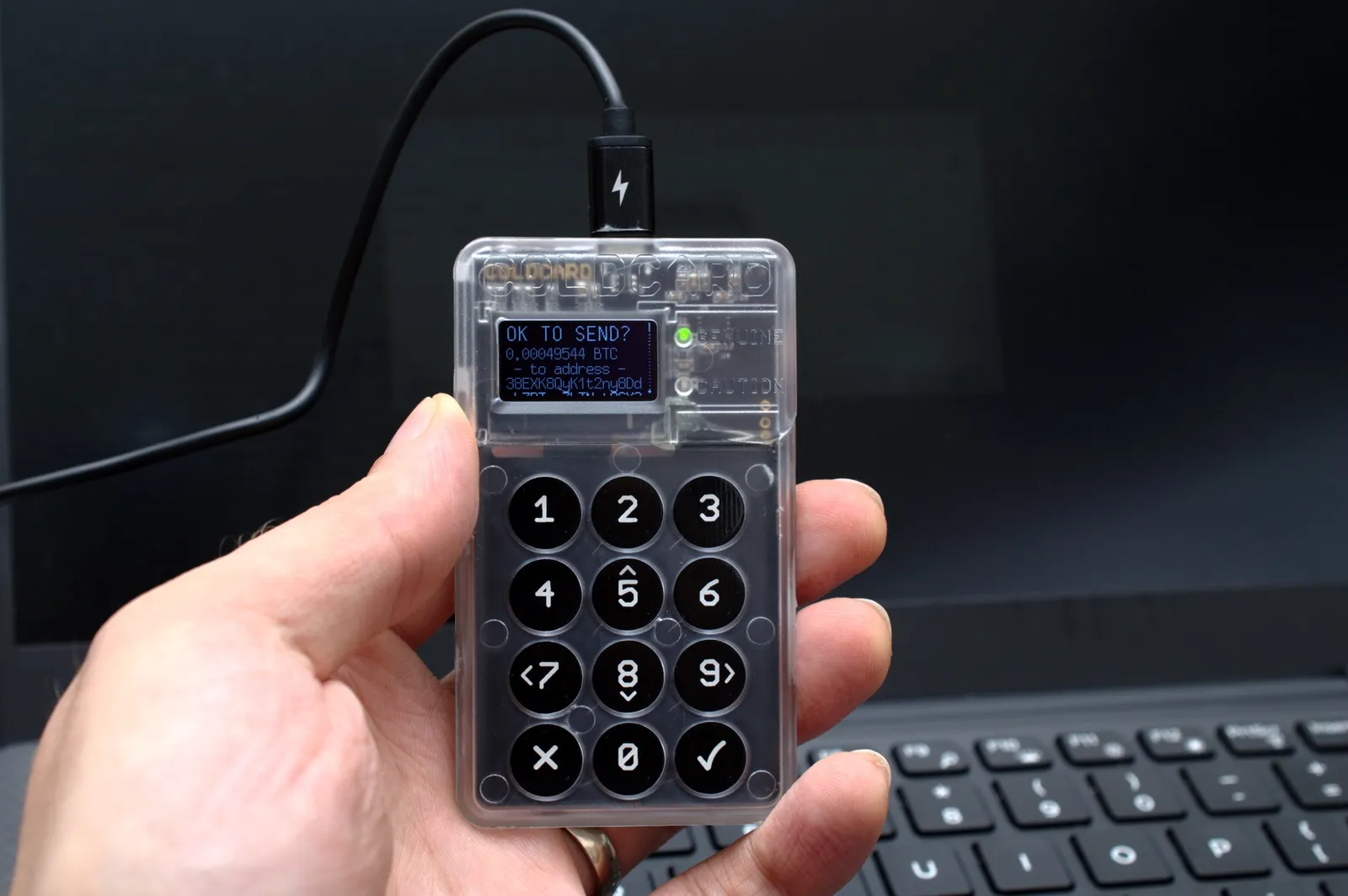 A Coldcard hardware wallet confirming a transaction